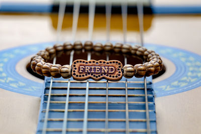 Wooden friend bracelet on guitar strings