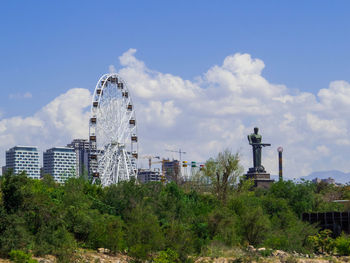 Buildings in city against sky