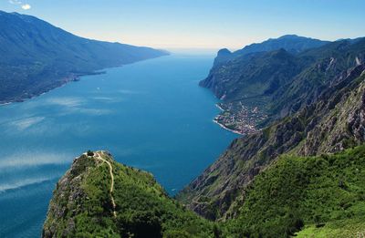 High angle view of lake garda and mountains against sky