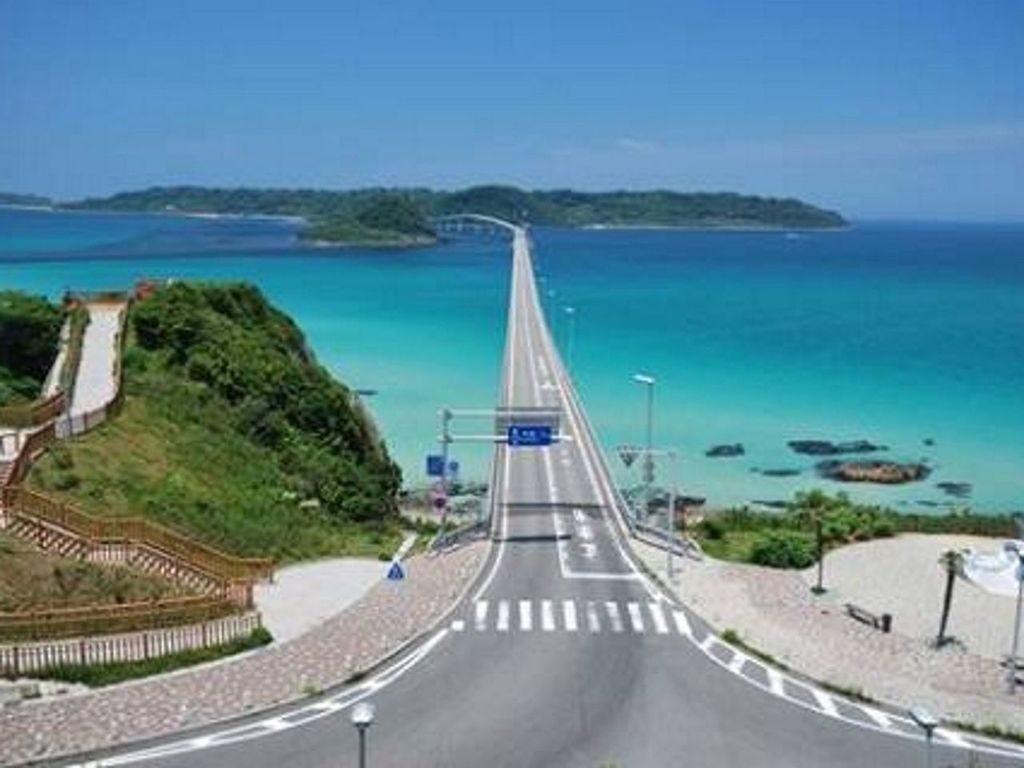 transportation, blue, sea, the way forward, road, water, clear sky, tree, diminishing perspective, mode of transport, mountain, tranquil scene, nature, sky, road marking, scenics, tranquility, vanishing point, horizon over water, travel