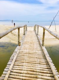 Pier over sea against sky