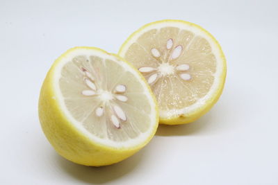 Close-up of lemon slice against white background