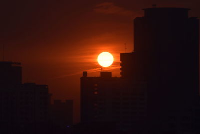 Silhouette of city at sunset