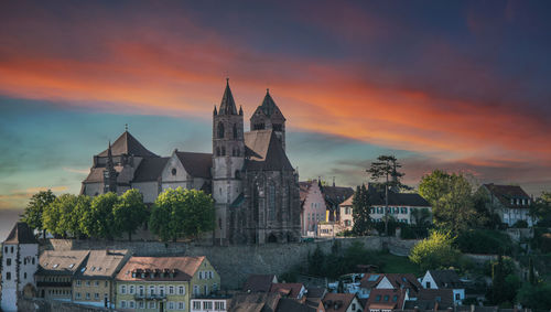 View of buildings against sky at sunset