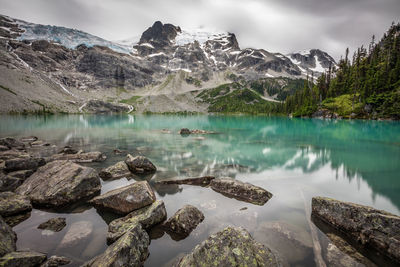 Rock hopping on the shoreline of upper joffre lake