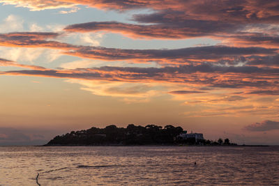 Scenic view of sea at sunset