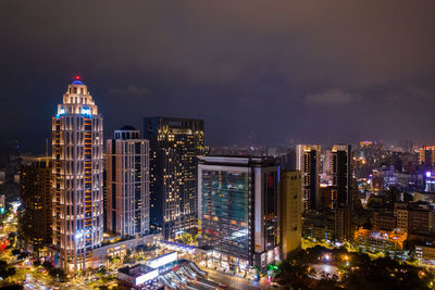 Illuminated buildings in city at night