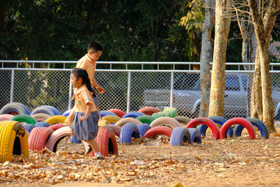 Low angle view of children playing on playground