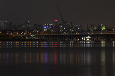 Illuminated bridge over han river against sky at night