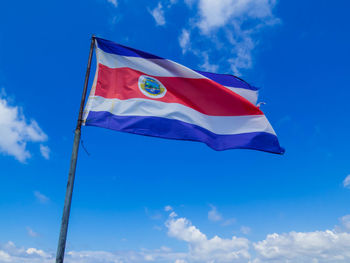 Low angle view of flag against sky
