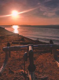 People on beach during sunset