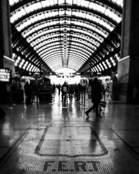 People walking at railroad station