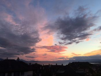 Silhouette buildings against sky during sunset