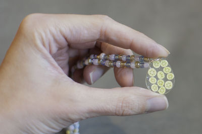 Close-up of person holding jewelry