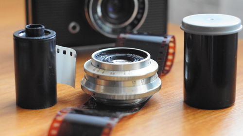 Close-up of photographic equipment on table