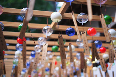 Low angle view of decorations hanging in row