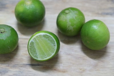 Close-up of green fruits on table