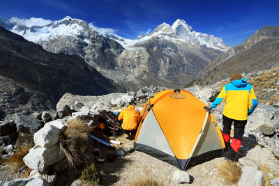 Rear view of tourists on mountain