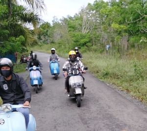 People riding motorcycle on road