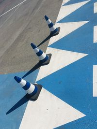 High angle view of arrow symbol on road