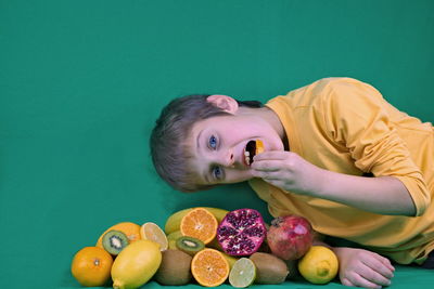 Portrait of man with fruits on table