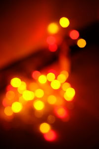 Defocused image of illuminated lights at night