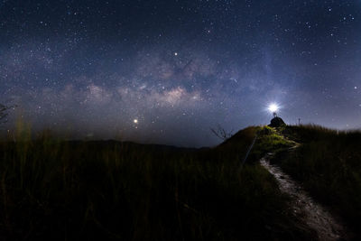 Scenic view of mountains against sky at night