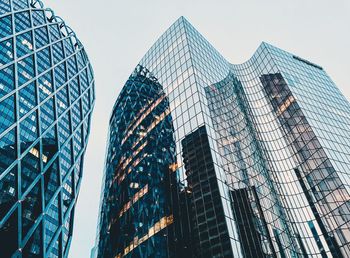 Low angle view of modern buildings against sky