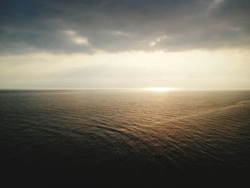 Scenic view of sea against sky at sunset