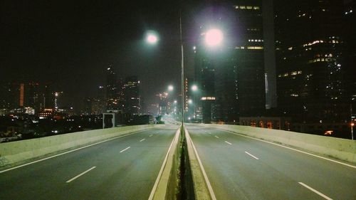 Illuminated street lights at night