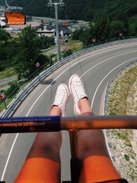Close-up of woman standing on wall