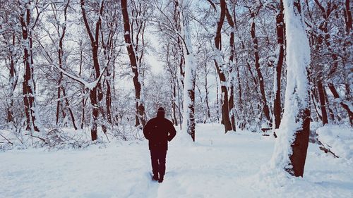 People standing on snow covered landscape