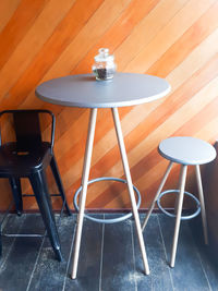 High angle view of empty chairs and table in restaurant