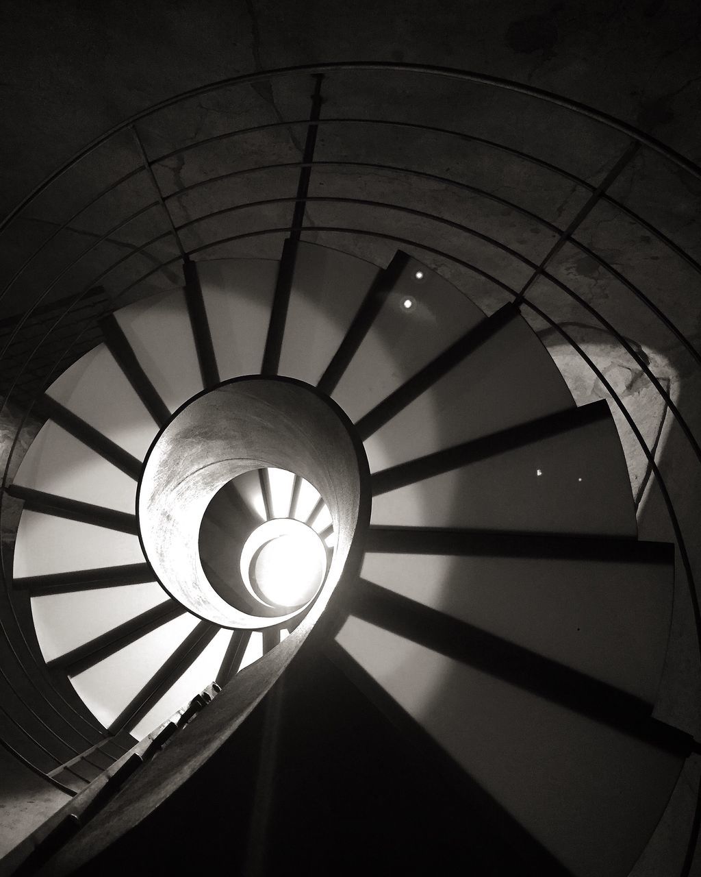 LOW ANGLE VIEW OF SPIRAL STAIRCASES