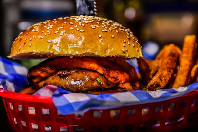 Close-up of burger with french fries in basket