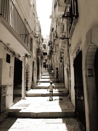 Narrow alley along buildings