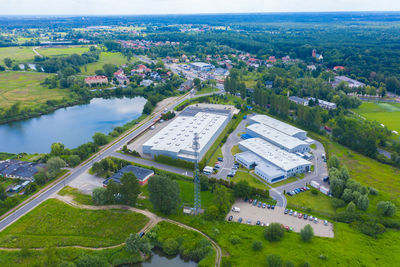 Aerial view of modern storage warehouse with solar panels on the roof. logistics center 