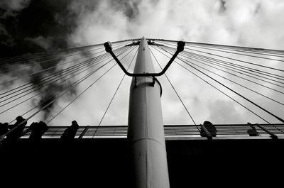 Low angle view of silhouette bridge against sky