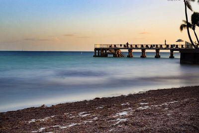 Scenic view of sea at sunset