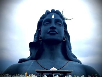 Low angle view of statue against sky