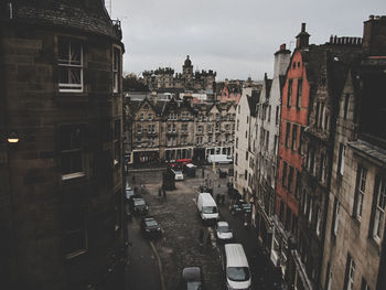 Street amidst buildings in city against sky