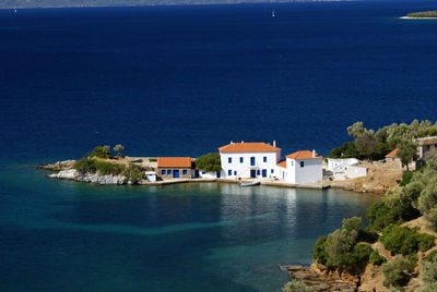 High angle view of buildings by sea