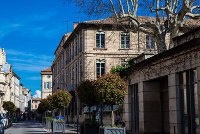 Low angle view of buildings against blue sky