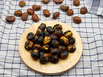 Fresh roasted chestnuts on a table.