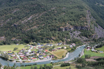 High angle view of buildings and trees in city