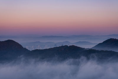 Scenic view of mountains against sky during sunset