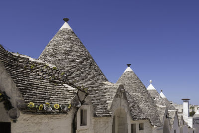 Scenic view of trulli whitewashed huts with conical roofs in alberobello in apulia in italy