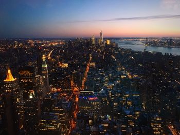 High angle view of illuminated city buildings at night