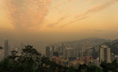 High angle view of buildings against sky during sunset