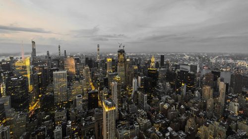 High angle view of city against cloudy sky